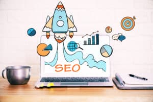 Various SEO elements and icons and a rocket ship launching from a laptop